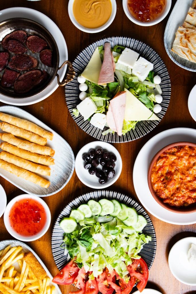 A table with plates of food and drinks